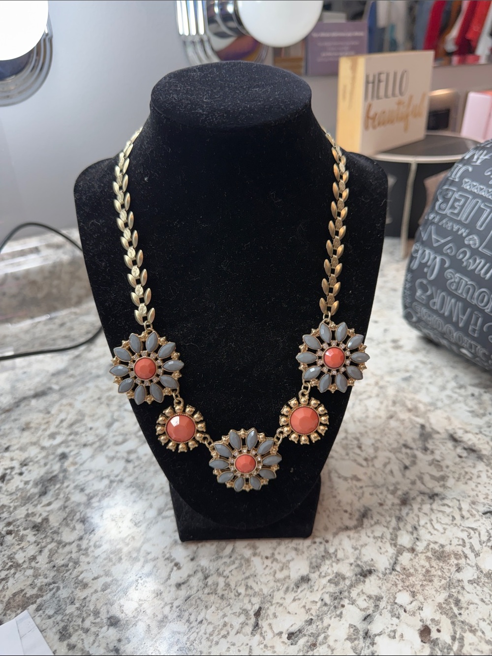 Gold-Tone Floral Statement Necklace with Coral and Light Gray Accents